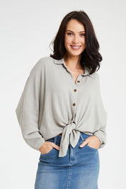 Model Andrea wearing size 10 of the Everyday Cool Cotton Shirt in colour Sage (Green), from the front, cropped image