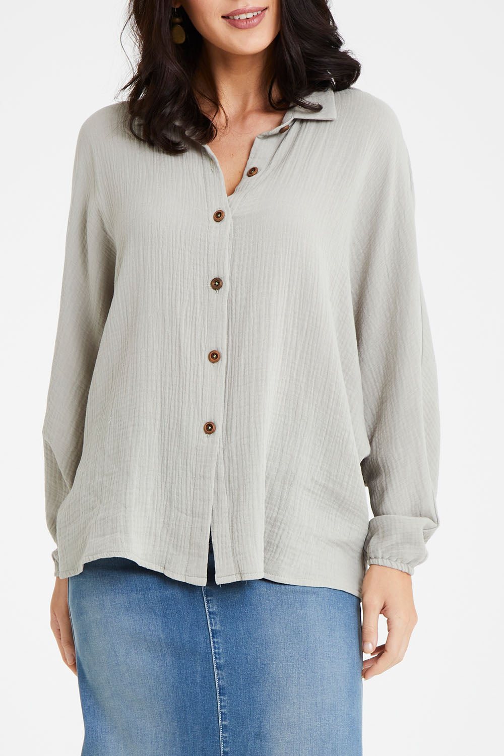 Model Andrea wearing size 10 of the Everyday Cool Cotton Shirt in colour Sage (Green), from the front, cropped image