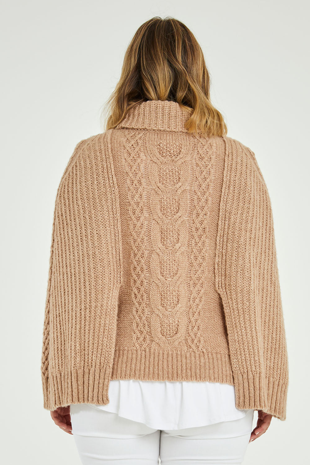 Model Jess wearing size L of the My Obsession Is You Poncho in colour Camel, from the back