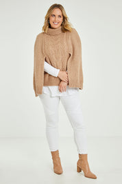 Model Jess wearing size L of the My Obsession Is You Poncho in colour Camel, from the front, showing the whole outfit