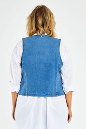 Model Jess wearing size 14 of the Fine and Dandy Denim Vest in colour Denim (Blue), from the back