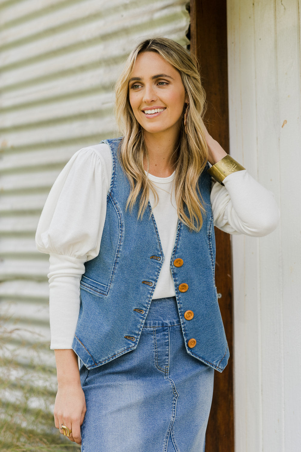 Model Tegan wearing size 10 of the Fine and Dandy Denim Vest in colour Denim (Blue), from the front, showing the whole outfit
