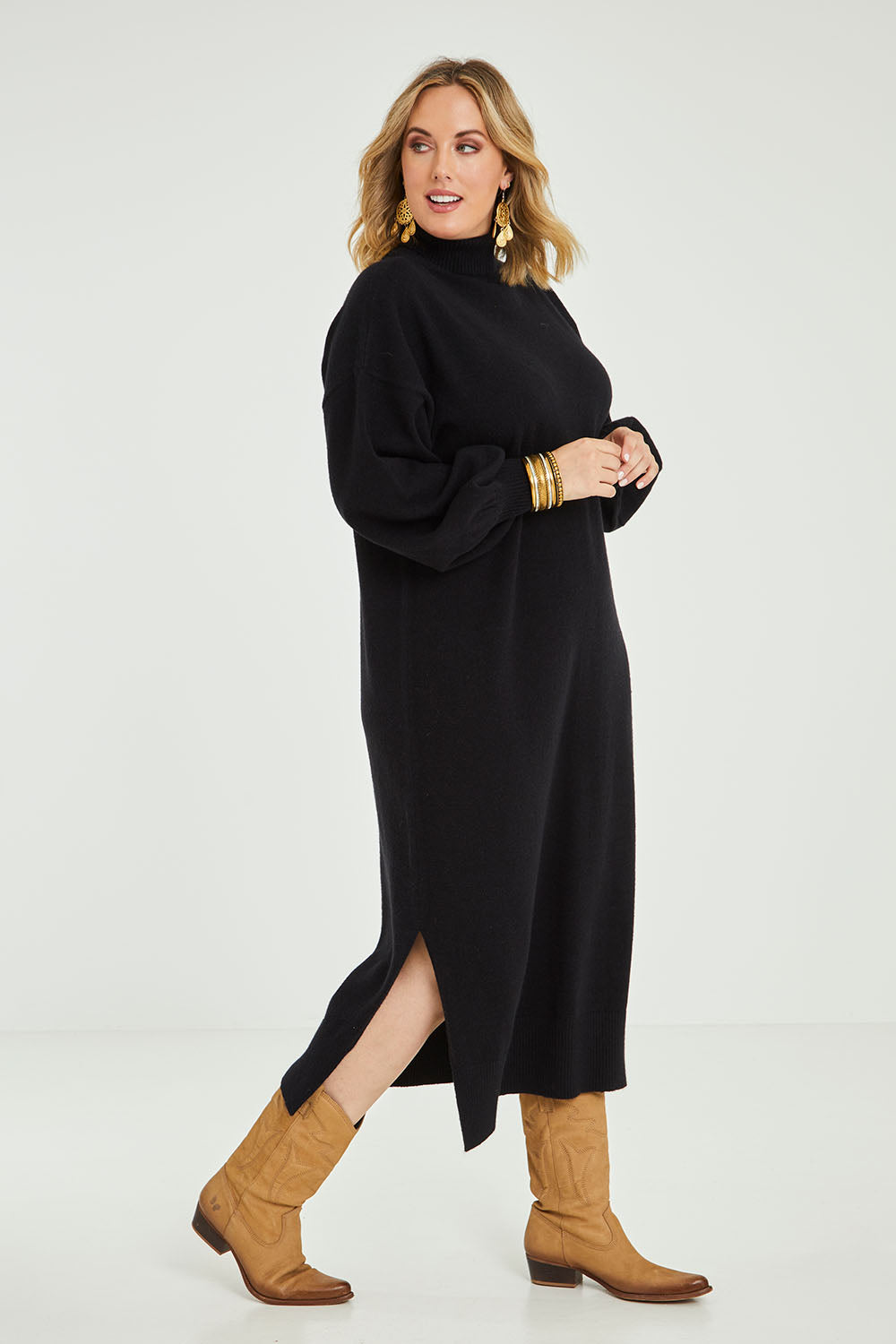 Model Jess wearing size L of the Cool Order Balloon Sleeve Dress in colour Black (Black), from the front, showing the whole outfit