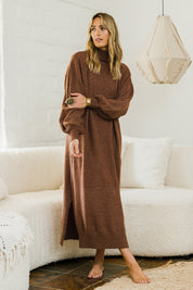 Model Tegan wearing size S of the Cool Order Balloon Sleeve Dress in colour Rust, from the front, showing the whole outfit