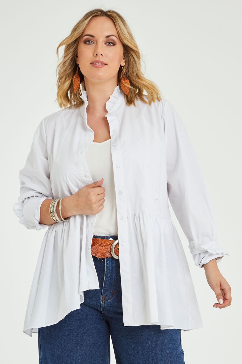 Model Jess wearing size 14 of The Frill You Give Me Blouse in colour White (White), from the front, cropped image