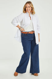 Model Jess wearing size 14 of The Frill You Give Me Blouse in colour White (White), from the front, showing the whole outfit