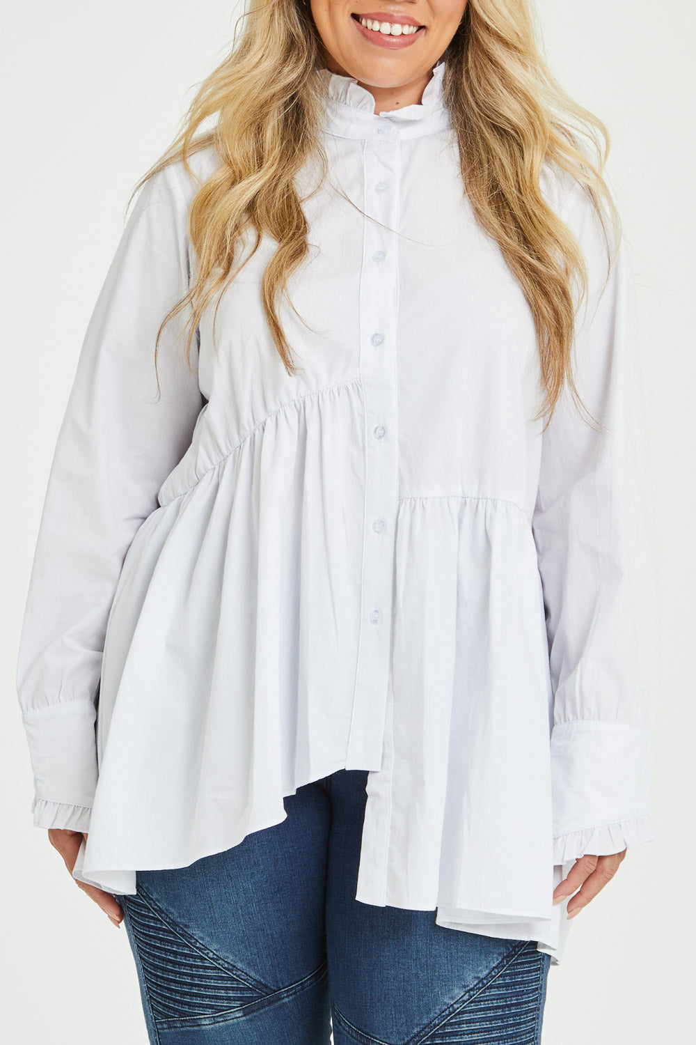 Model Katie wearing size 16 of The Frill You Give Me Blouse in colour White (White), from the front, cropped image