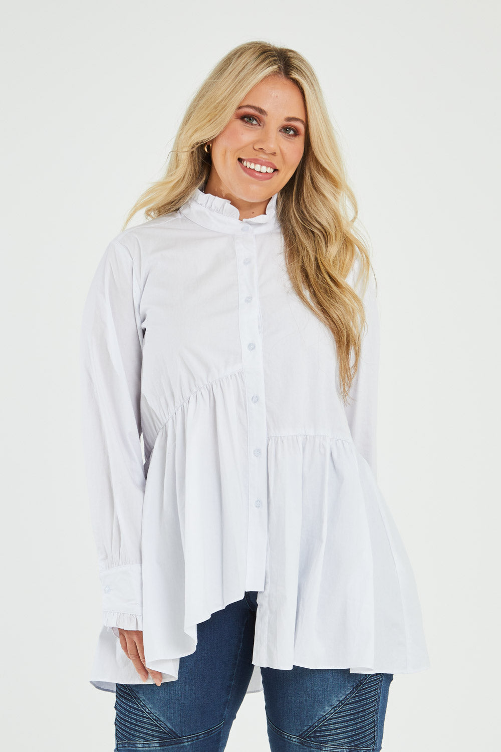 Model Katie wearing size 16 of The Frill You Give Me Blouse in colour White (White), from the front, cropped image