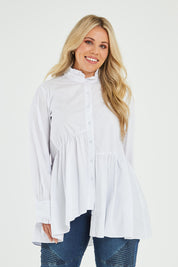 Model Katie wearing size 16 of The Frill You Give Me Blouse in colour White (White), from the front, cropped image