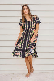 Model Tegand wearing size 10 of the Love Shack Midi Dress – Blackfleur in colour Blackfleur, from the front