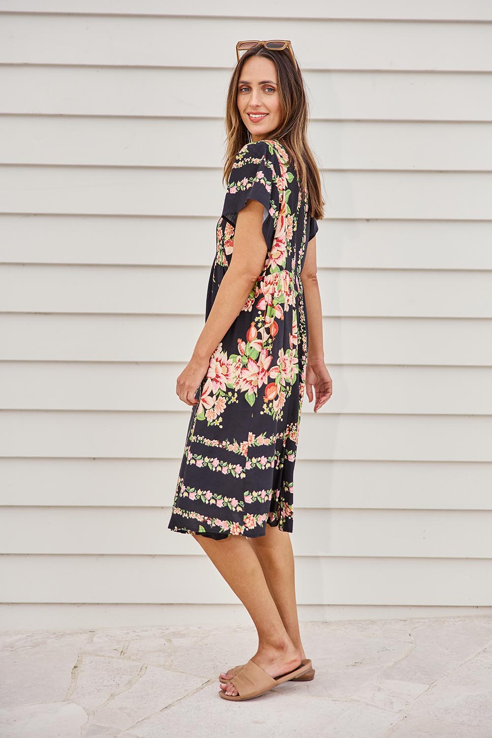 Model Tegand wearing size 10 of the Love Shack Midi Dress – Blackfleur in colour Blackfleur, from the front