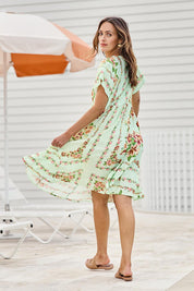 Model Tegand wearing size 10 of the Love Shack Midi Dress – Greenfleur in colour Greenfleur, from the front
