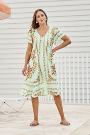 Model Tegand wearing size 10 of the Love Shack Midi Dress – Greenfleur in colour Greenfleur, from the front