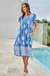 Model Tegand wearing size 10 of the Love Shack Dress - Denimfleur in colour Denimfleur, from the front