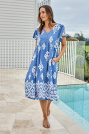 Model Tegand wearing size 10 of the Love Shack Dress - Denimfleur in colour Denimfleur, from the front