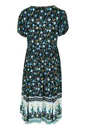 Product shot of the Love Shack Dress in colour Blackfleur (Black), from the back