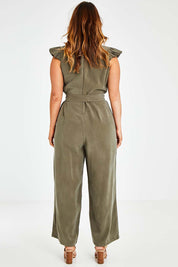 Model Laura wearing size 14 of the I See You Jumpsuit in colour Olive (Green), from the back