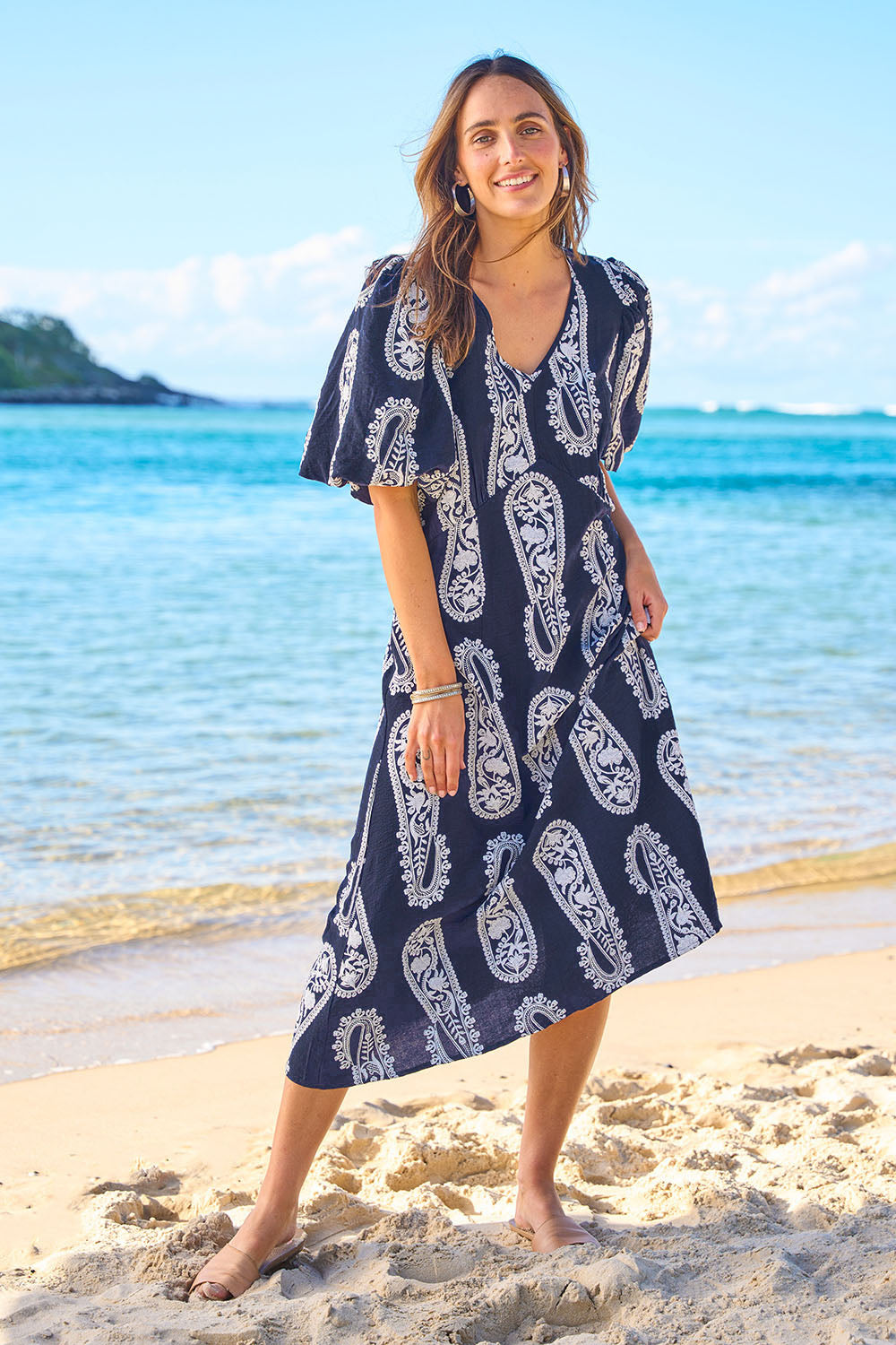 Model Tegan wearing size 10 of the You Make Me Feel Like Dancing Dress in colour Navypais (Blue), from the front, showing the whole outfit