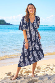 Model Tegan wearing size 10 of the You Make Me Feel Like Dancing Dress in colour Navypais (Blue), from the front, showing the whole outfit