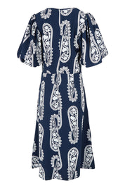 Product shot of the You Make Me Feel Like Dancing Dress in colour Navypais (Blue), from the back