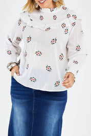 Model Jess wearing size 14 of the Ruffle My Feathers Blouse in colour Chalk (White), from the front, cropped image