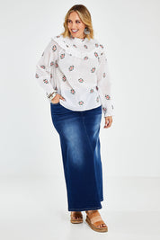 Model Jess wearing size 14 of the Ruffle My Feathers Blouse in colour Chalk (White), from the front, showing the whole outfit