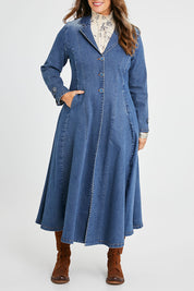 Model Laura wearing size 14 of the Meet Me At Midnight Denim Coat in colour Darkdenim (Blue), from the front, cropped image