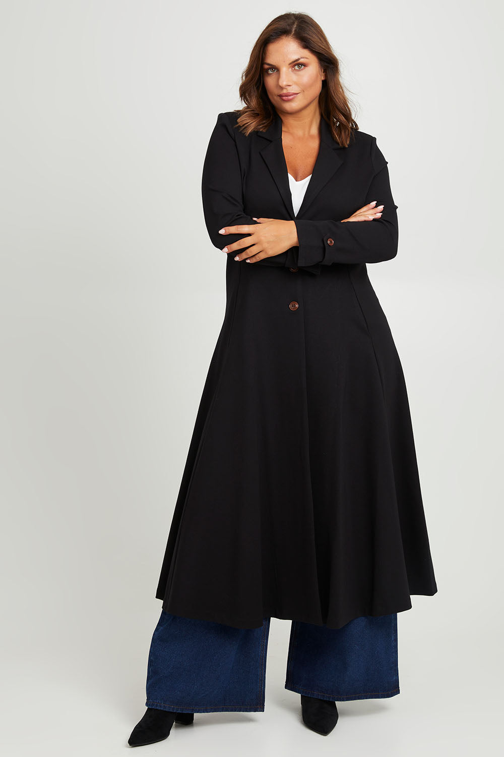 Model Monique wearing size 14 of the Meet Me At Midnight Longline Ponte Coat in colour Black (Black), from the front, showing the whole outfit
