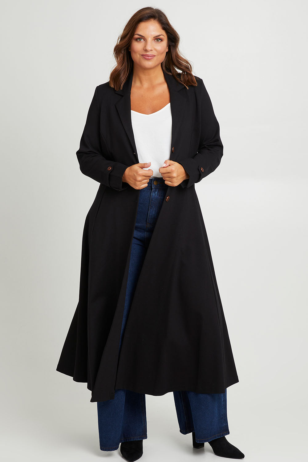 Model Monique wearing size 14 of the Meet Me At Midnight Longline Ponte Coat in colour Black (Black), from the front, showing the whole outfit