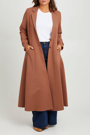 Model Monique wearing size 14 of the Meet Me At Midnight Longline Ponte Coat in colour Cinnamon, from the front, cropped image