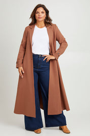 Model Monique wearing size 14 of the Meet Me At Midnight Longline Ponte Coat in colour Cinnamon, from the front, showing the whole outfit