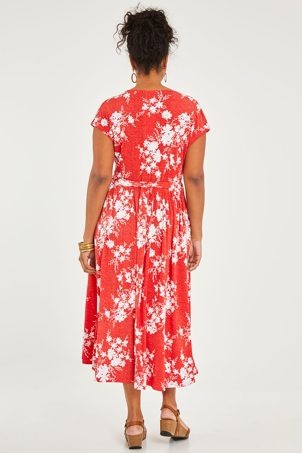 Model Noli wearing size 14 of the Feels Like Summer Wrap Dress in colour Tomato (Red), from the back