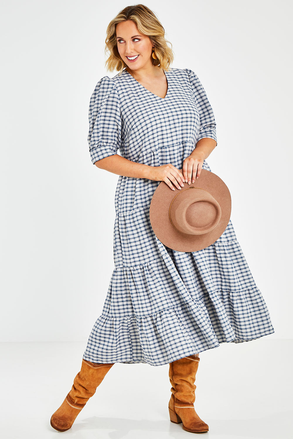 Model Jess wearing size 14 of the Tiers Of Delight Dress in colour Bluecheck (Blue), from the front, showing the whole outfit