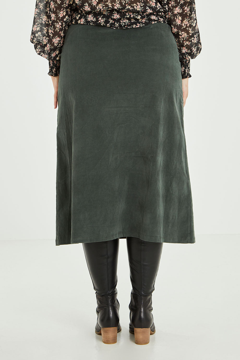 Model Jess wearing size 14 of the Smooth Lines Stretch Cord Skirt in colour Khaki (Green), from the back
