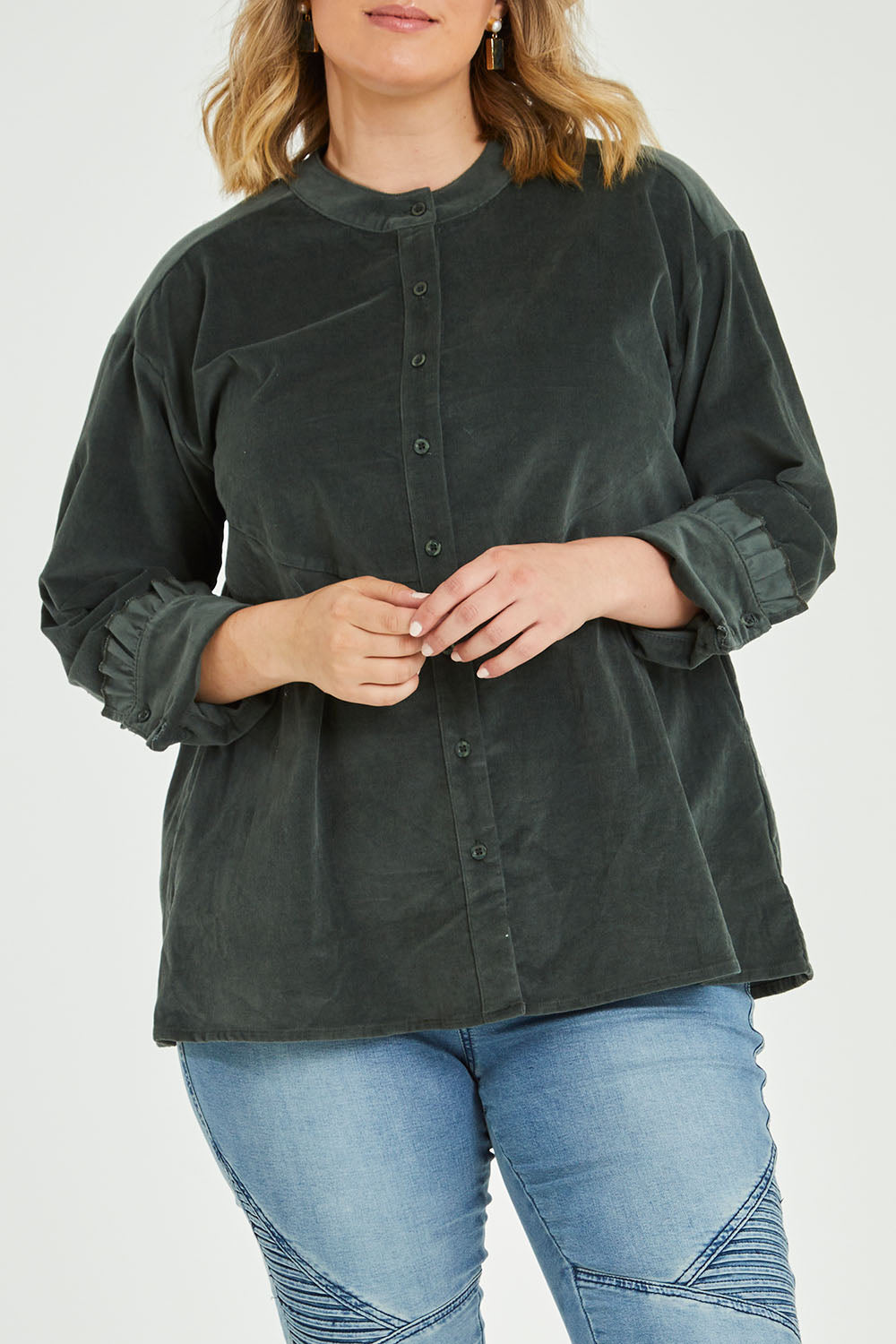 Model Jess wearing size 14 of the Going The Distance Cord Shirt Jacket in colour Khaki (Green), from the front, cropped image