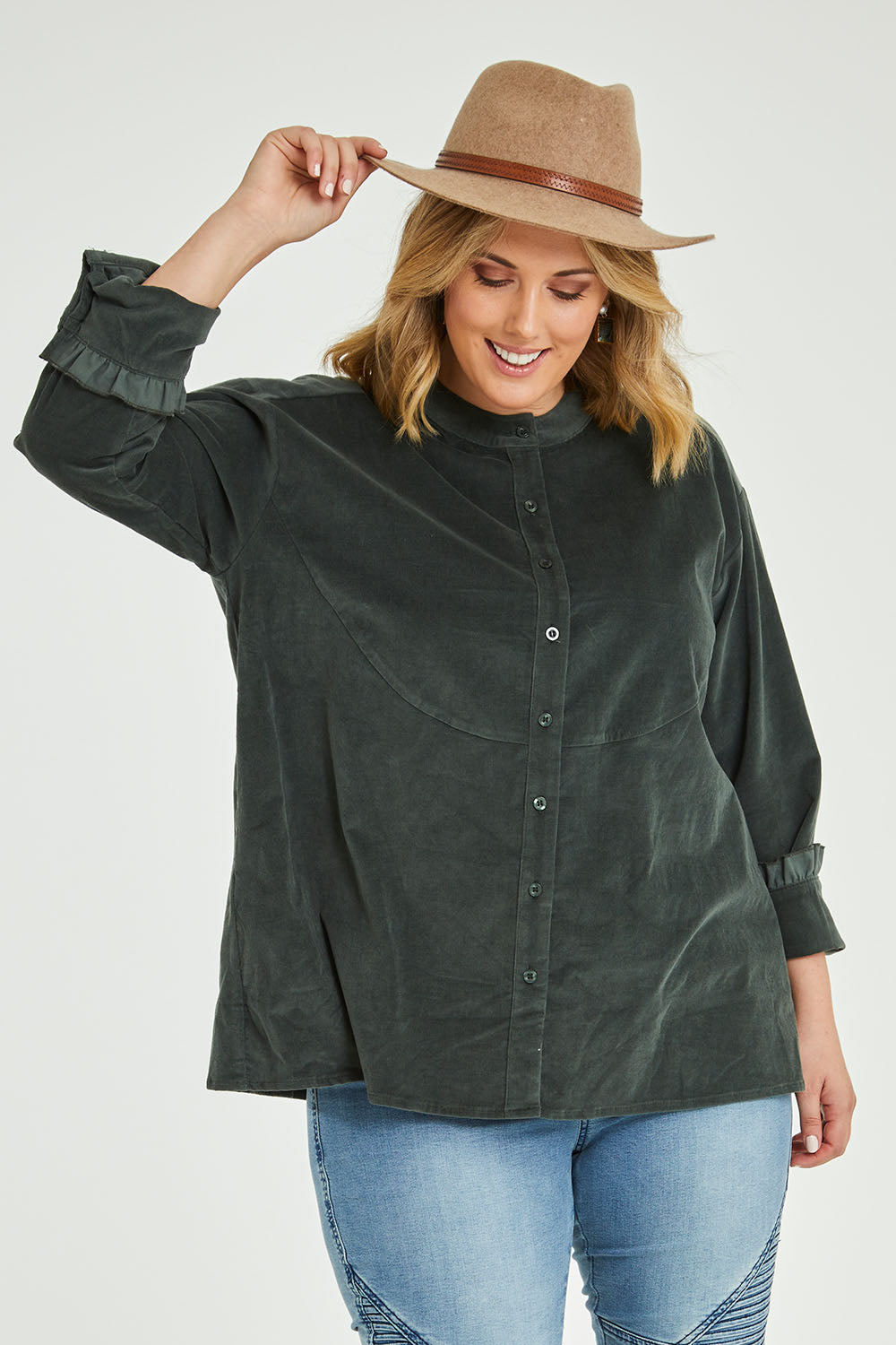 Model Jess wearing size 14 of the Going The Distance Cord Shirt Jacket in colour Khaki (Green), from the front, cropped image