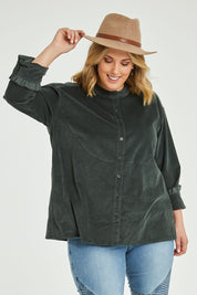 Model Jess wearing size 14 of the Going The Distance Cord Shirt Jacket in colour Khaki (Green), from the front, cropped image