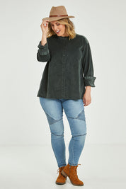 Model Jess wearing size 14 of the Going The Distance Cord Shirt Jacket in colour Khaki (Green), from the front, showing the whole outfit