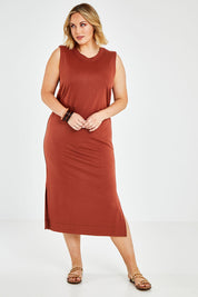 Model Jess wearing size 14 of the Ready For Anything Tank Dress in colour Ochre, from the front, showing the whole outfit
