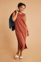 Model Noli wearing size 14 of the Ready For Anything Tank Dress in colour Ochre, from the front, showing the whole outfit