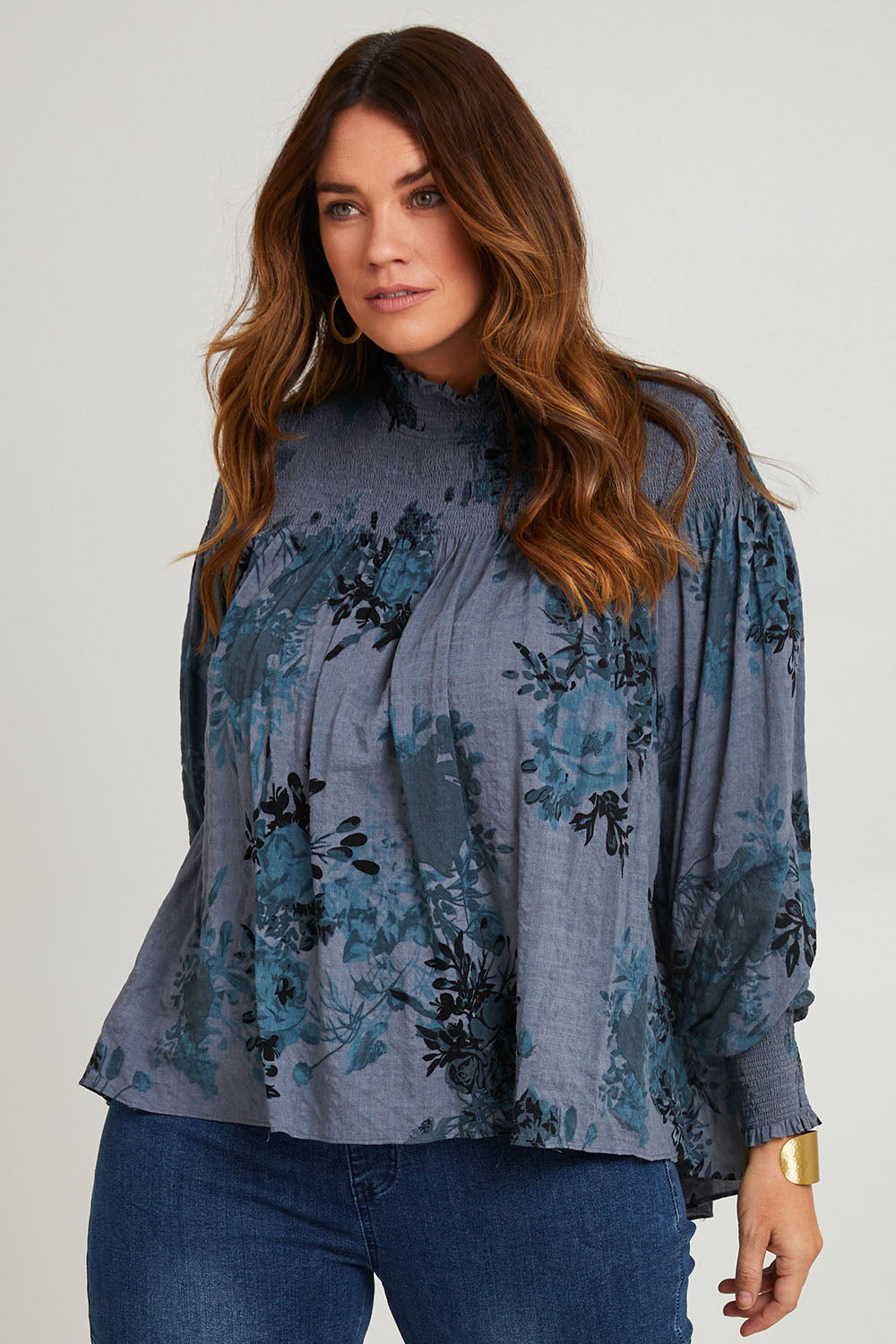 Model Laura wearing size 14 of the Romance In The Air Blouse in colour Smoke (Grey), from the front, cropped image