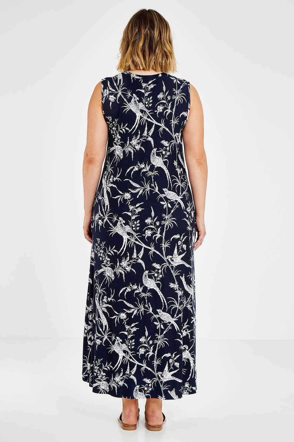 Model Jess wearing size 14 of the Hanging With My Birds Dress in colour Navybird (Blue), from the back