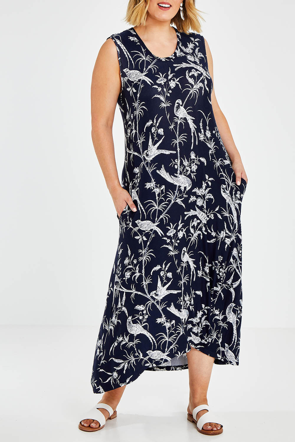 Model Jess wearing size 14 of the Hanging With My Birds Dress in colour Navybird (Blue), from the front, cropped image