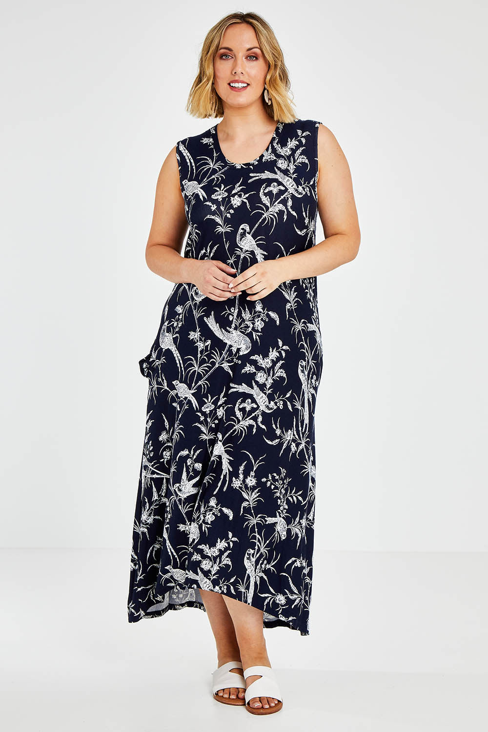 Model Jess wearing size 14 of the Hanging With My Birds Dress in colour Navybird (Blue), from the front, showing the whole outfit