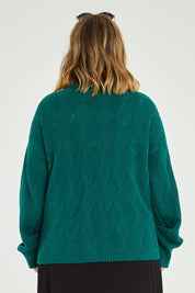 Model Jess wearing size L of the Cross My Heart Stitch Sweater in colour Jade (Green), from the back