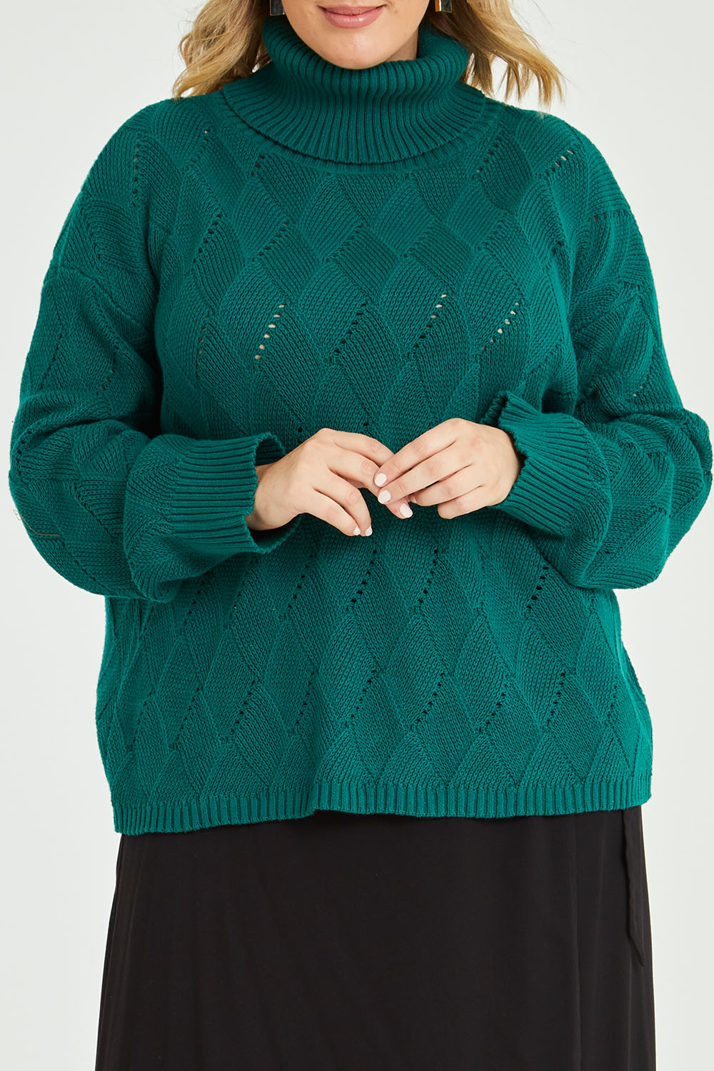Model Jess wearing size L of the Cross My Heart Stitch Sweater in colour Jade (Green), from the front, cropped image