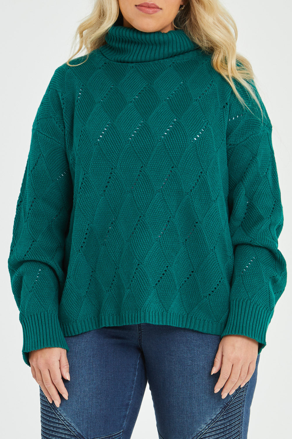 Model Katie wearing size XL of the Cross My Heart Stitch Sweater in colour Jade (Green), from the front, cropped image