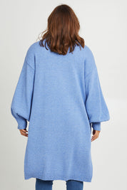 Model Monique wearing size L of the A True Jewel Cardi in colour Sky (Blue), from the back