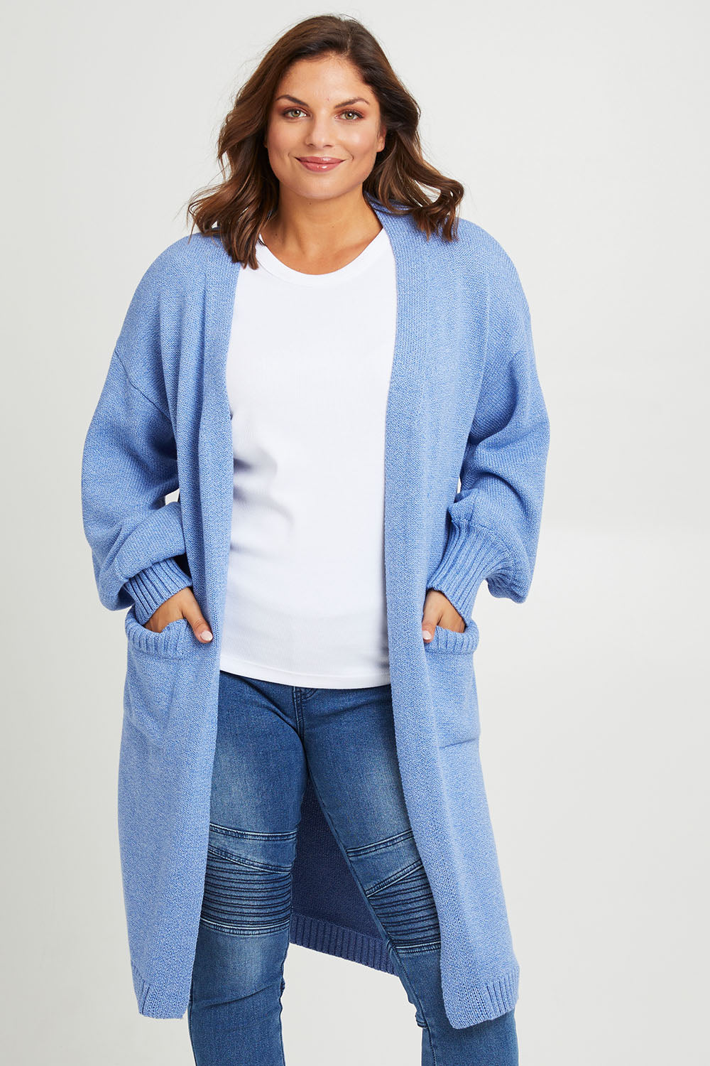 Model Monique wearing size L of the A True Jewel Cardi in colour Sky (Blue), from the back
