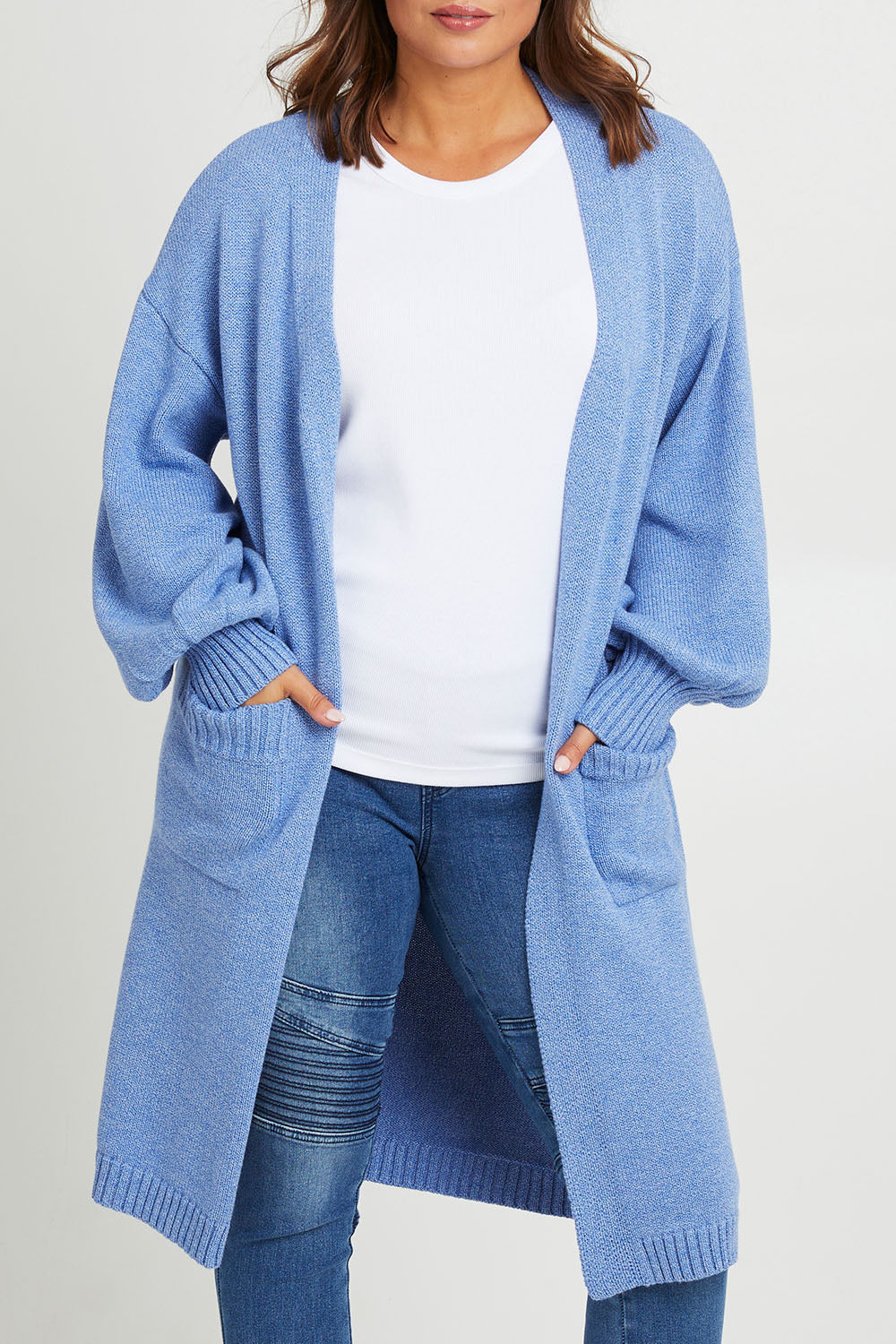 Model Monique wearing size L of the A True Jewel Cardi in colour Sky (Blue), from the front, cropped image
